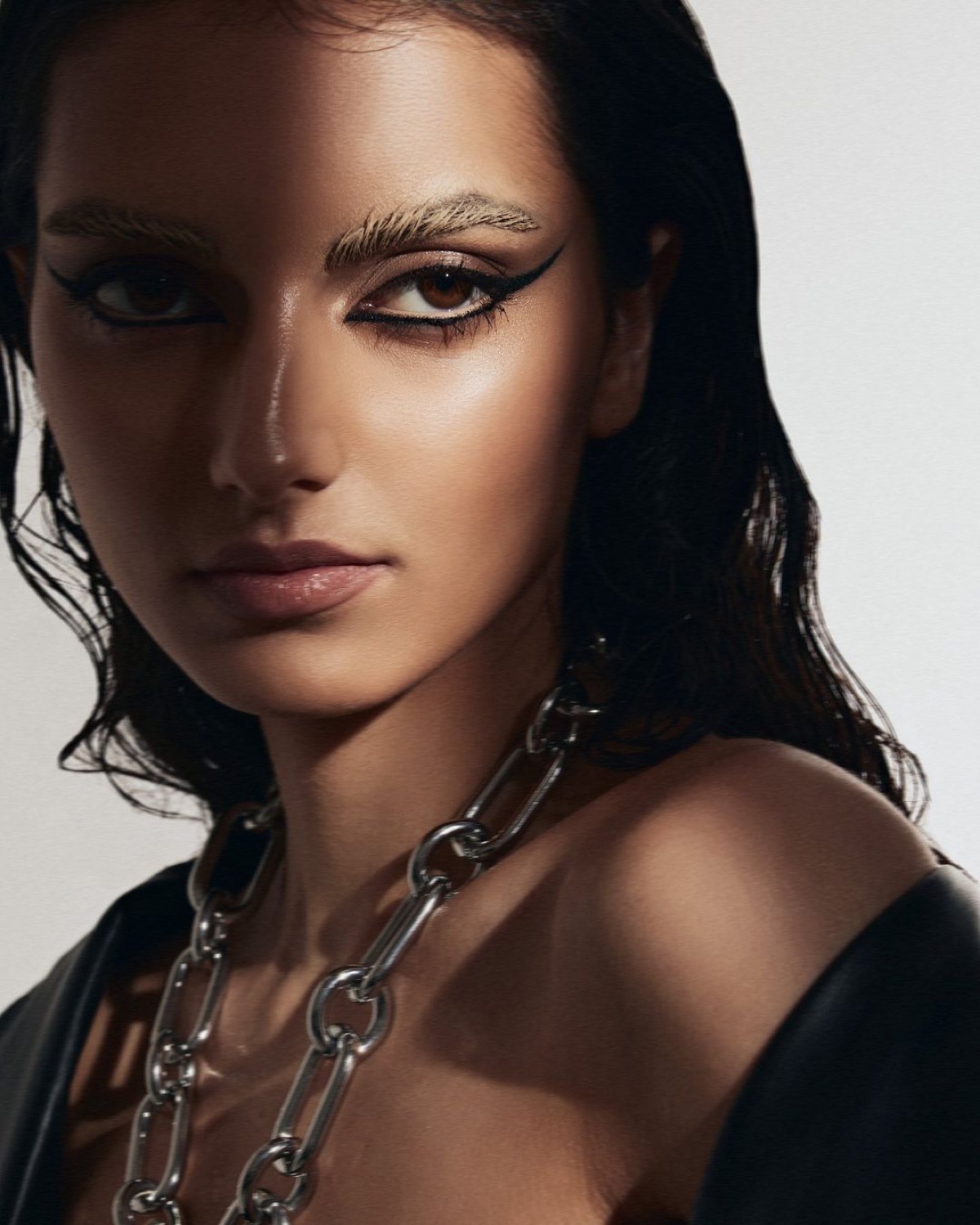 South Asian beauty close-up — defined eye makeup and clear skin